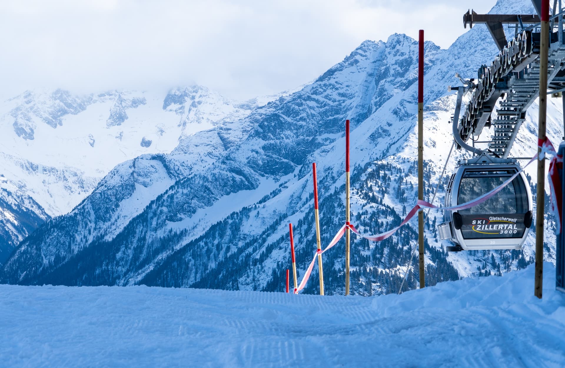 Gondola taking skiers to top of snowy mountain ski slope in Mayrhofen Austria